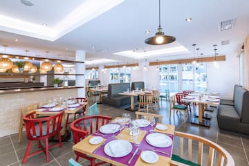 a room with tables and chairs