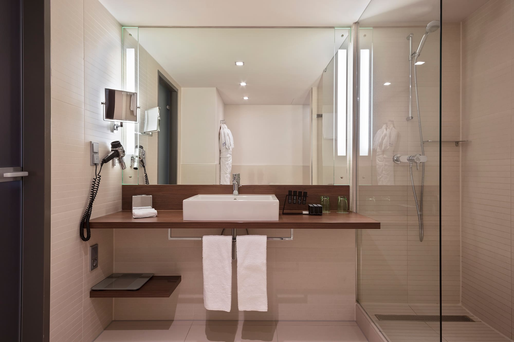 a bathroom with a sink and shower