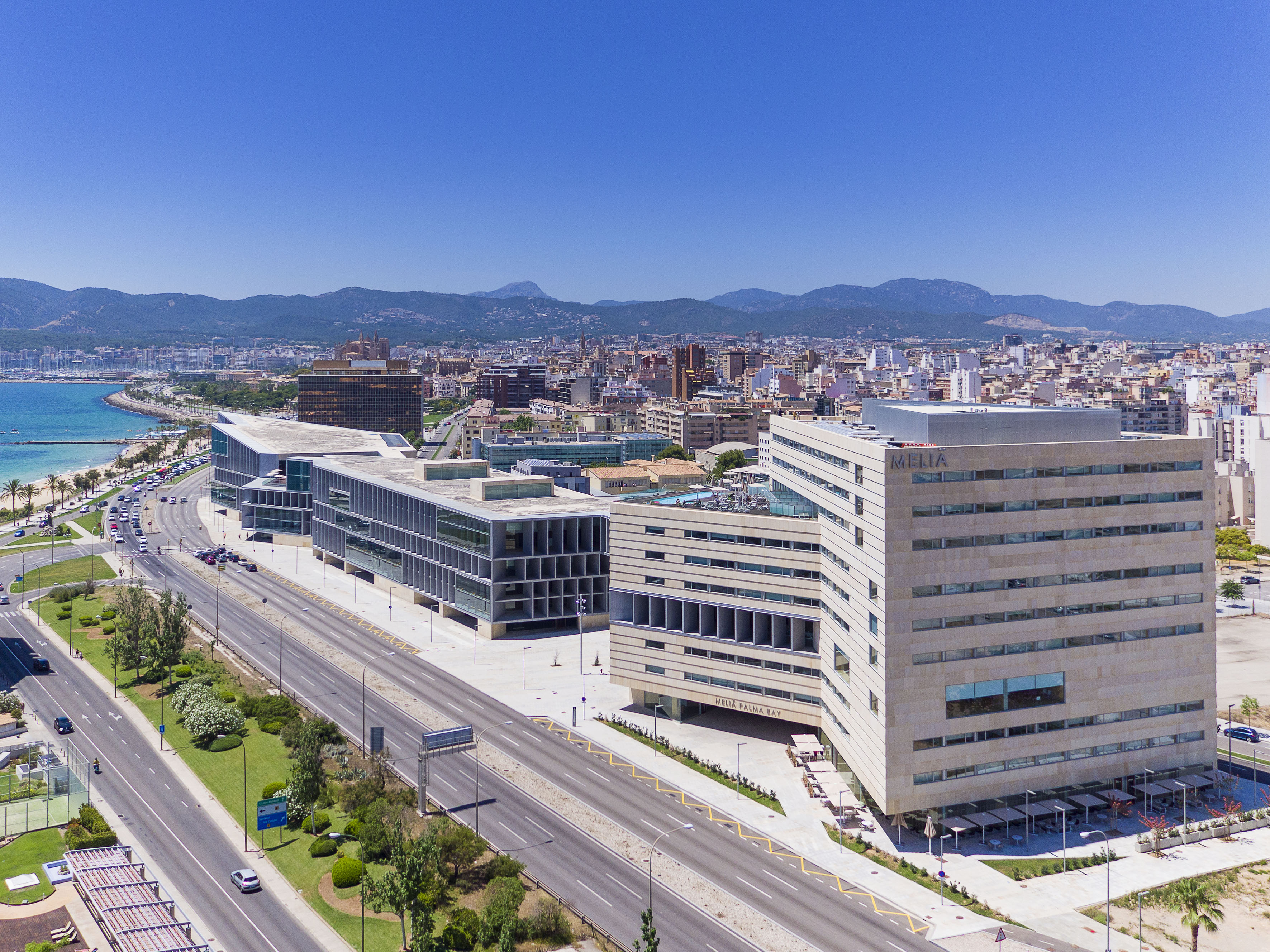 Meliá Palma Bay and cityscape along Palma Bay, Mallorca, with mountains.