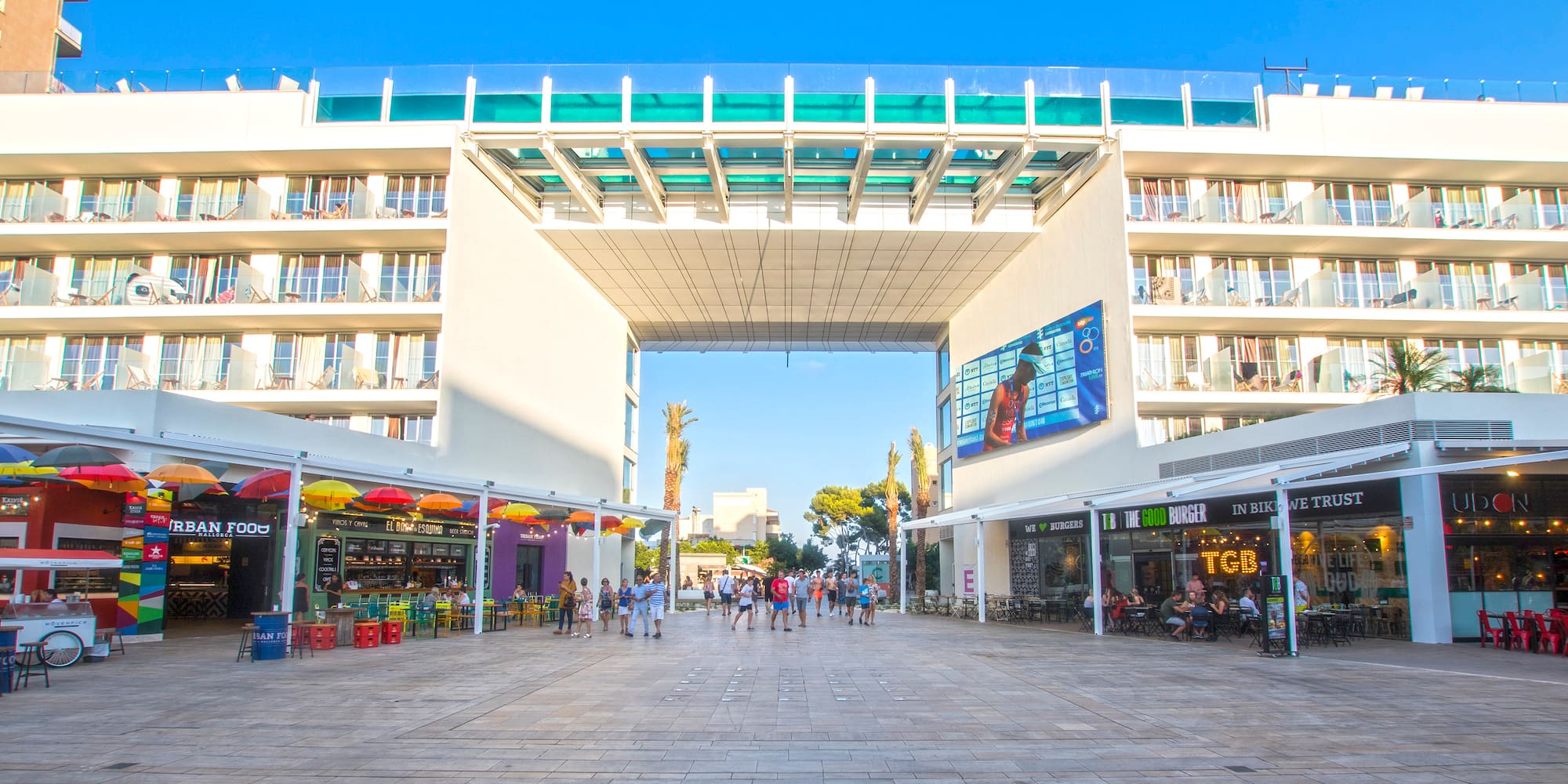 a group of people walking in a courtyard