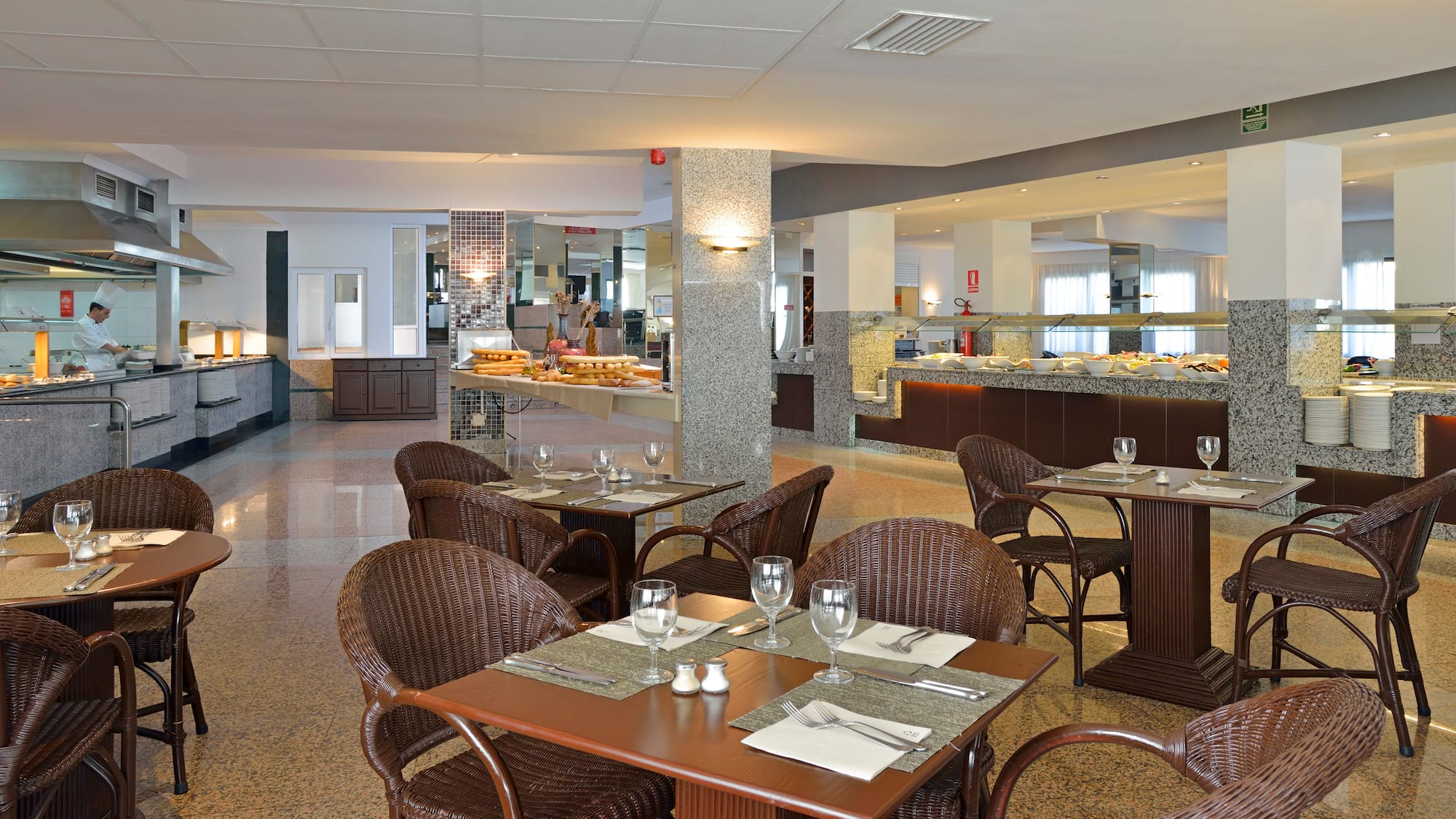 a restaurant with tables and chairs