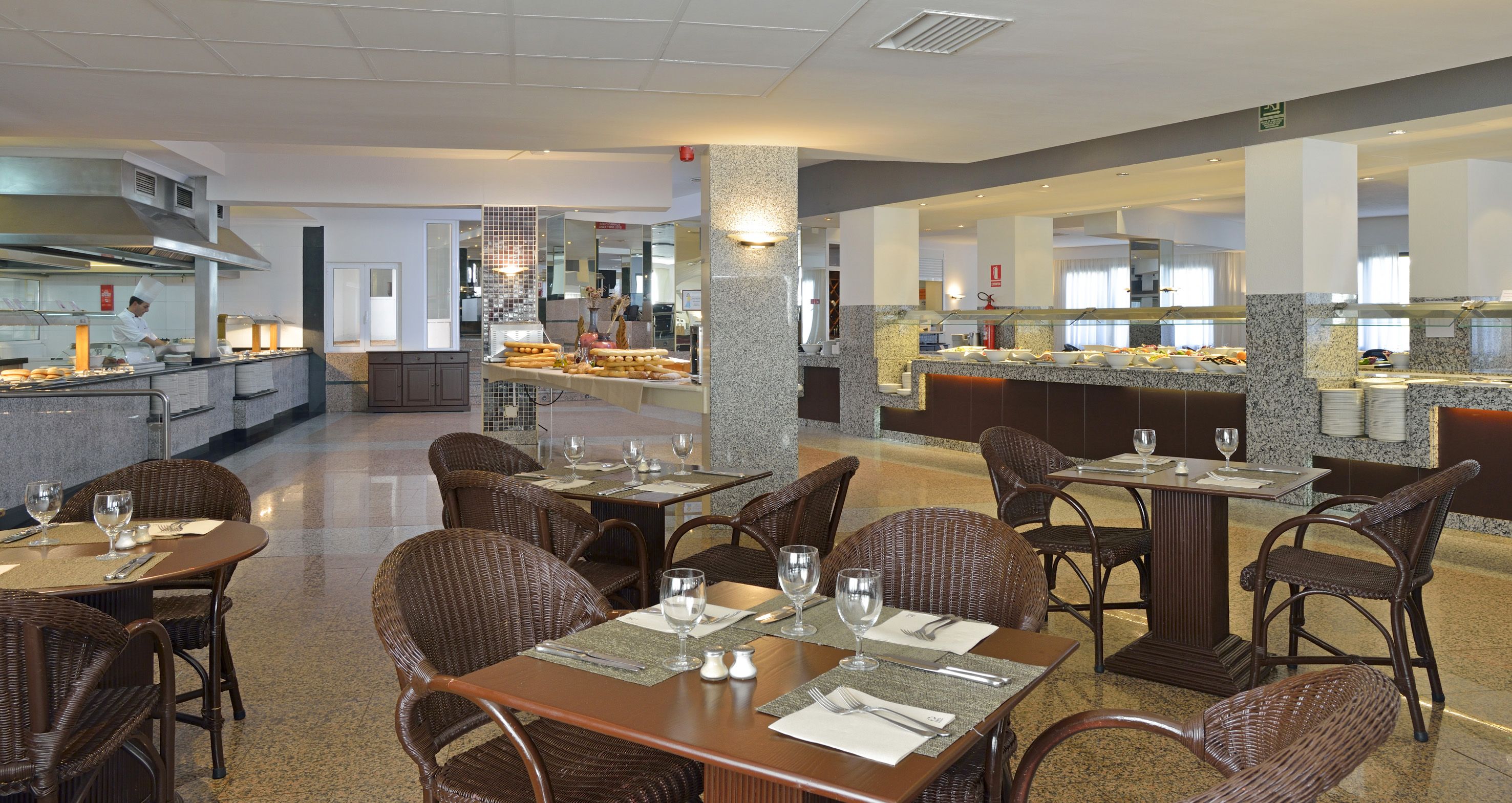 a restaurant with tables and chairs