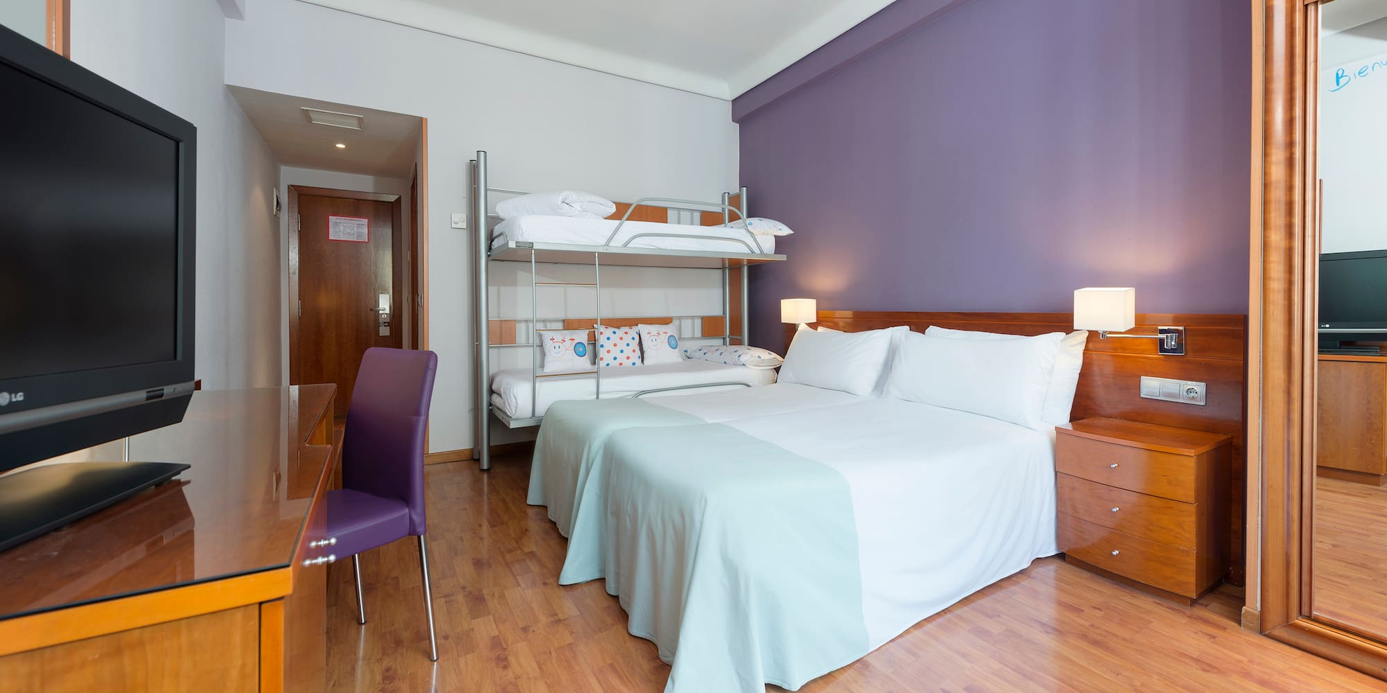 a room with a bed and a desk