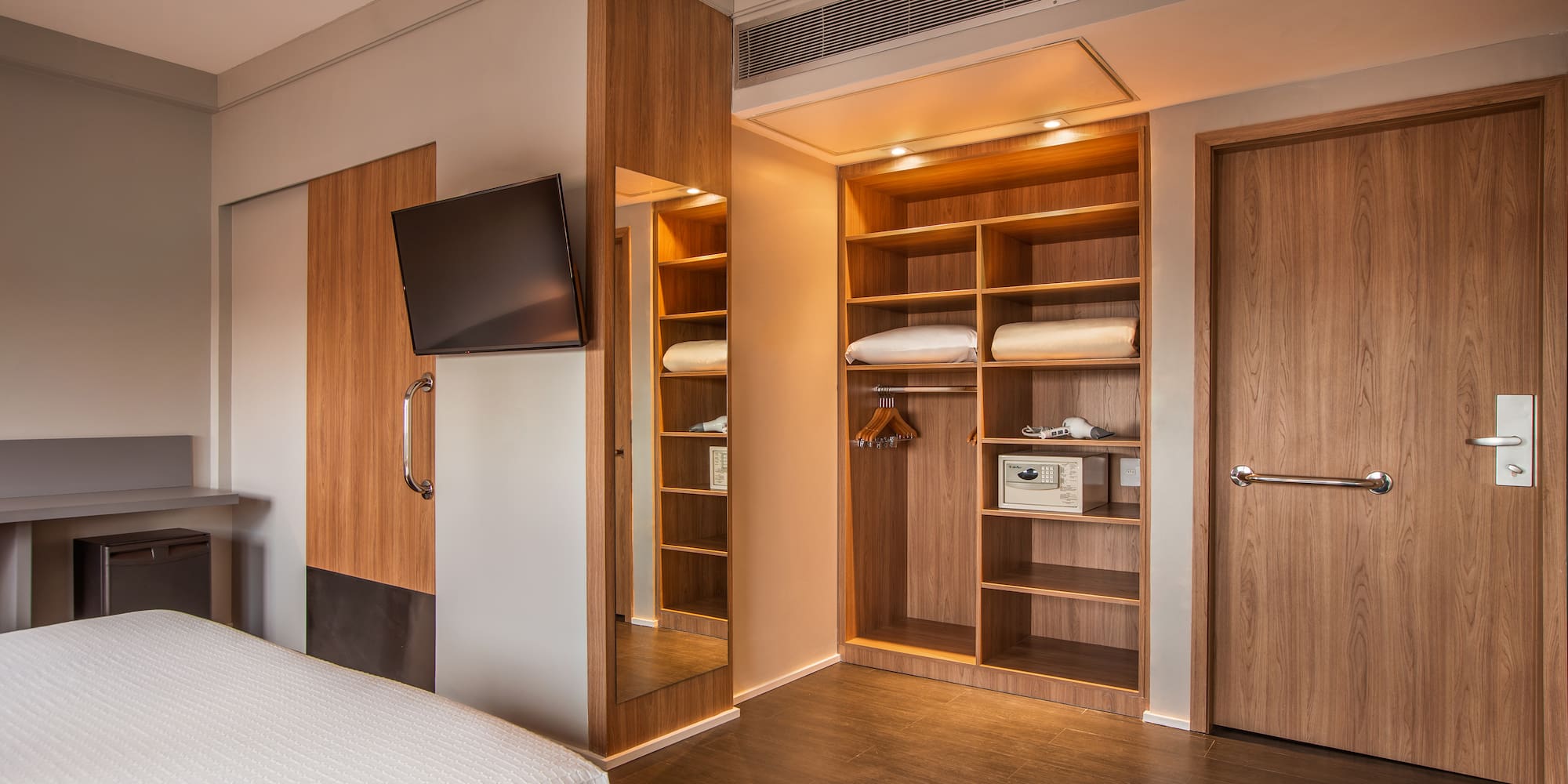 a room with a tv and a bed