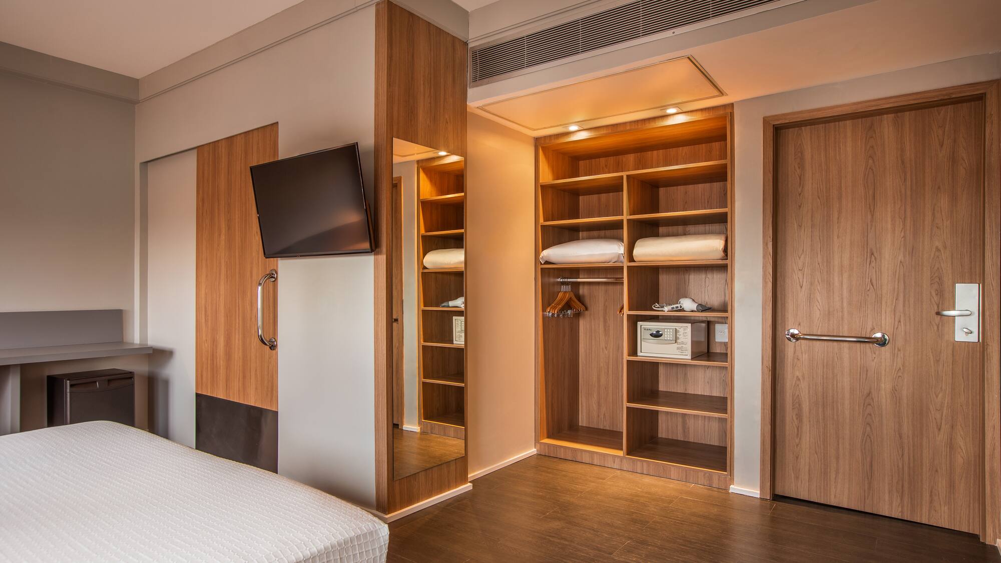 a room with a tv and a bed