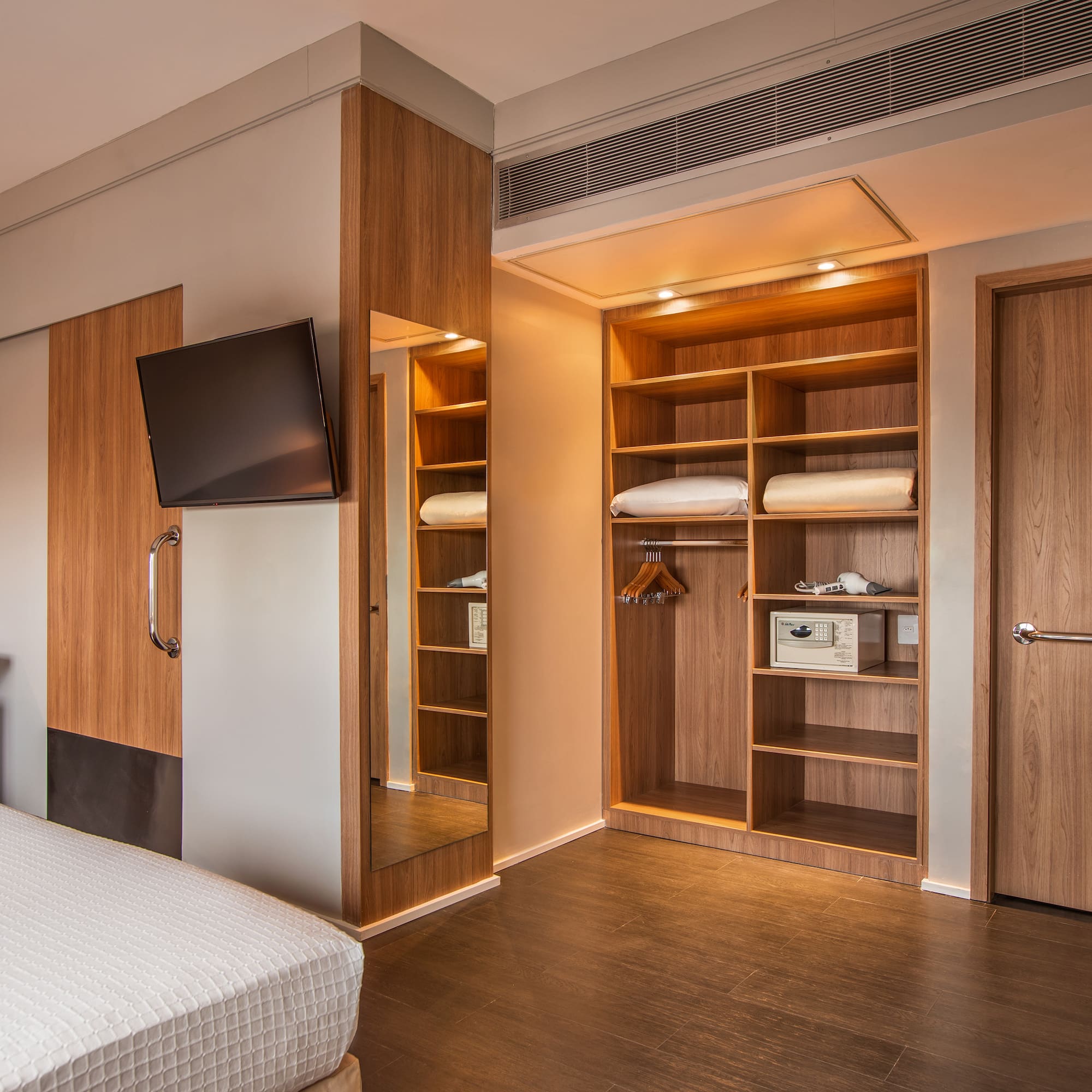 a room with a tv and a bed