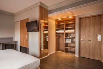 a room with a tv and a bed