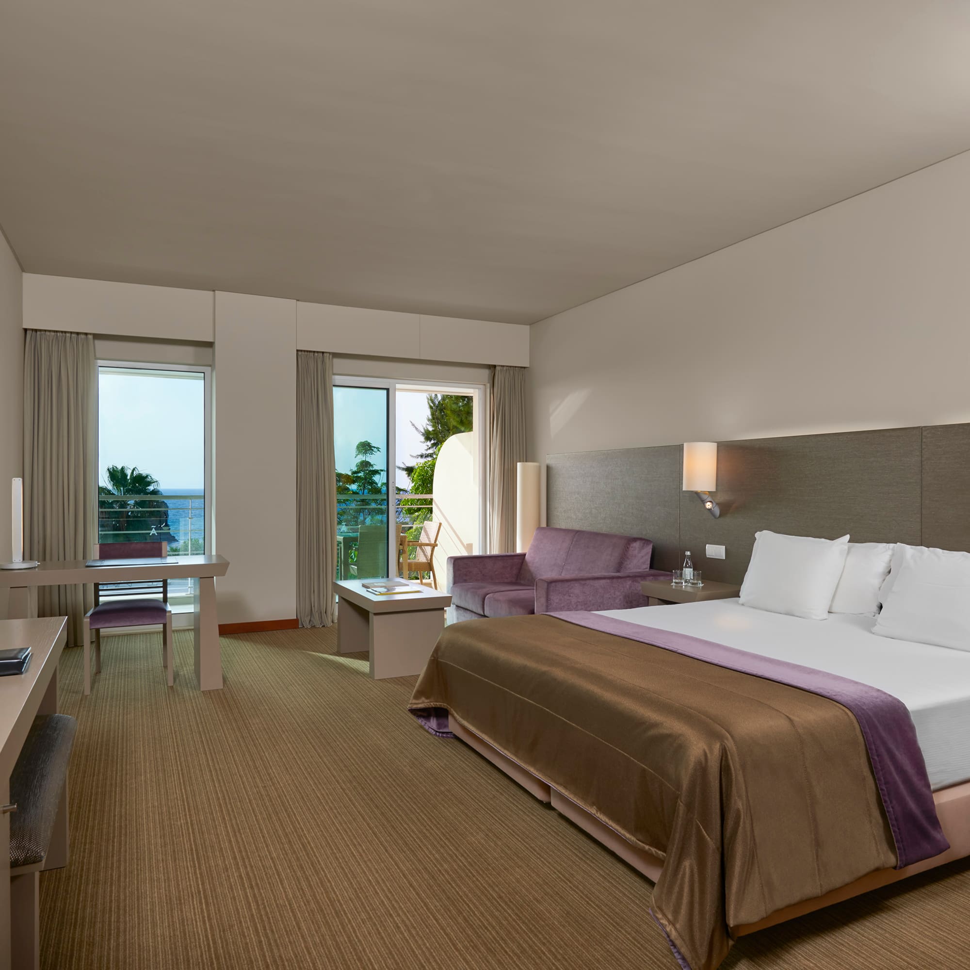 a room with a bed and a desk