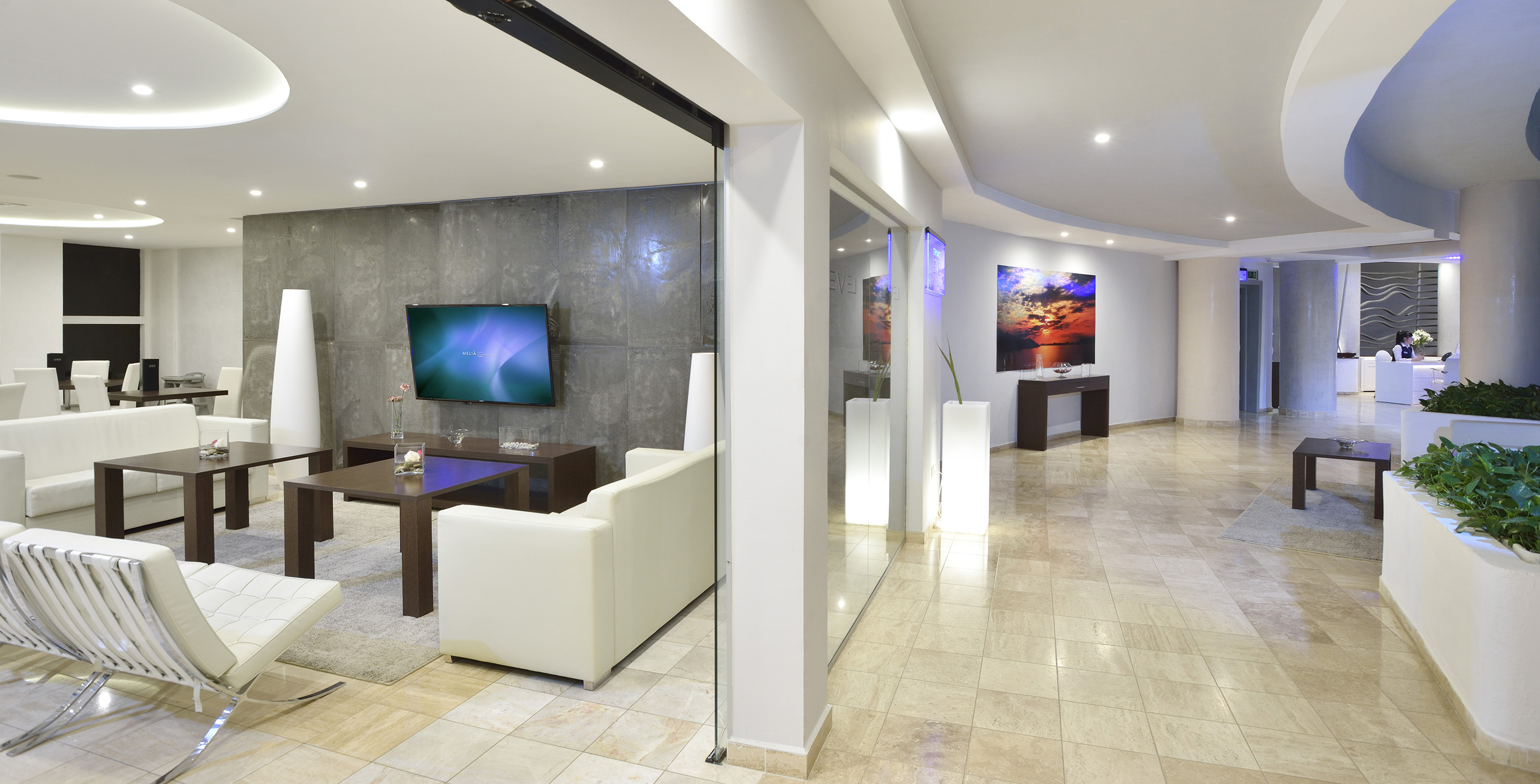 a room with a tv and a wall