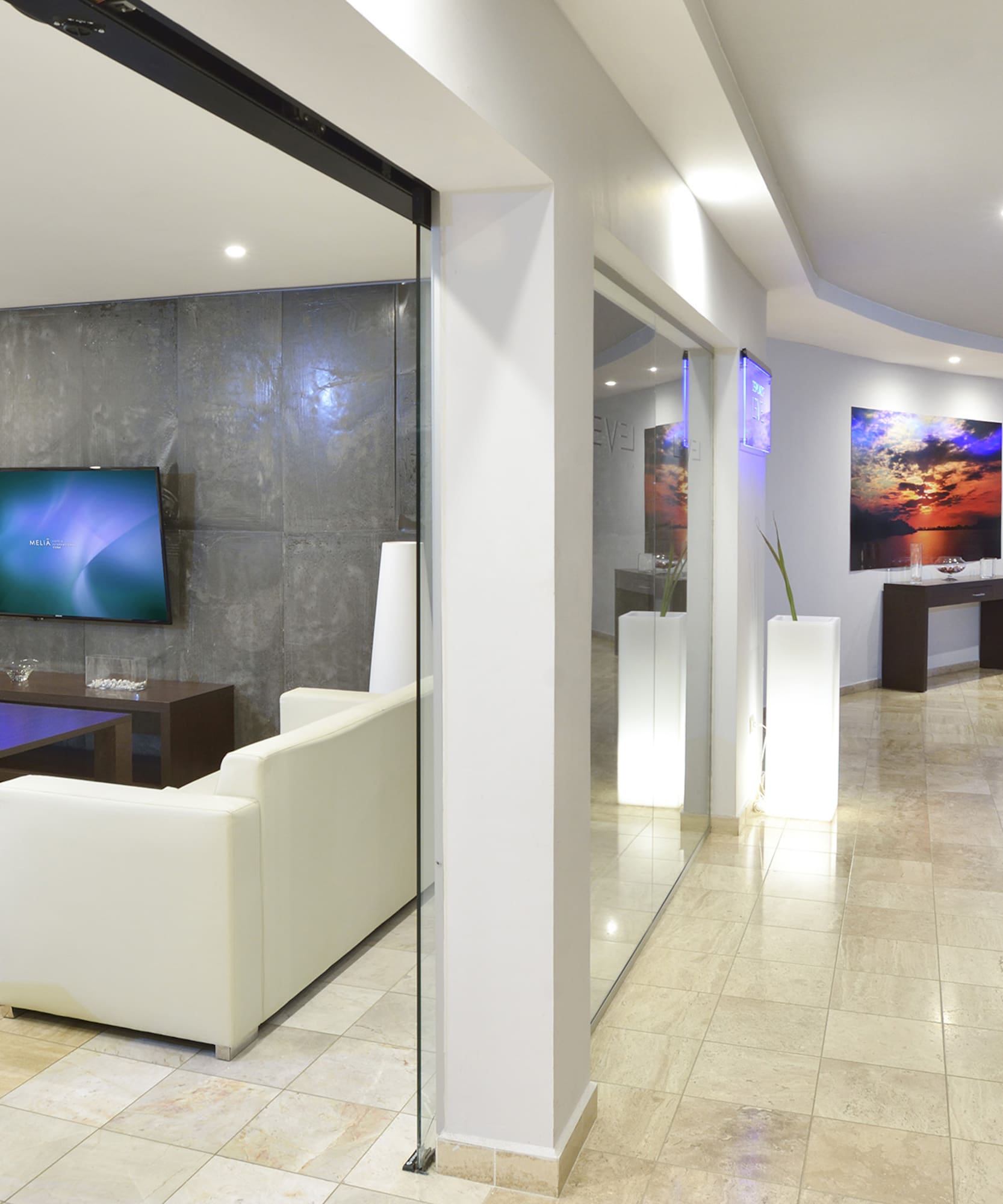 a room with a tv and a wall