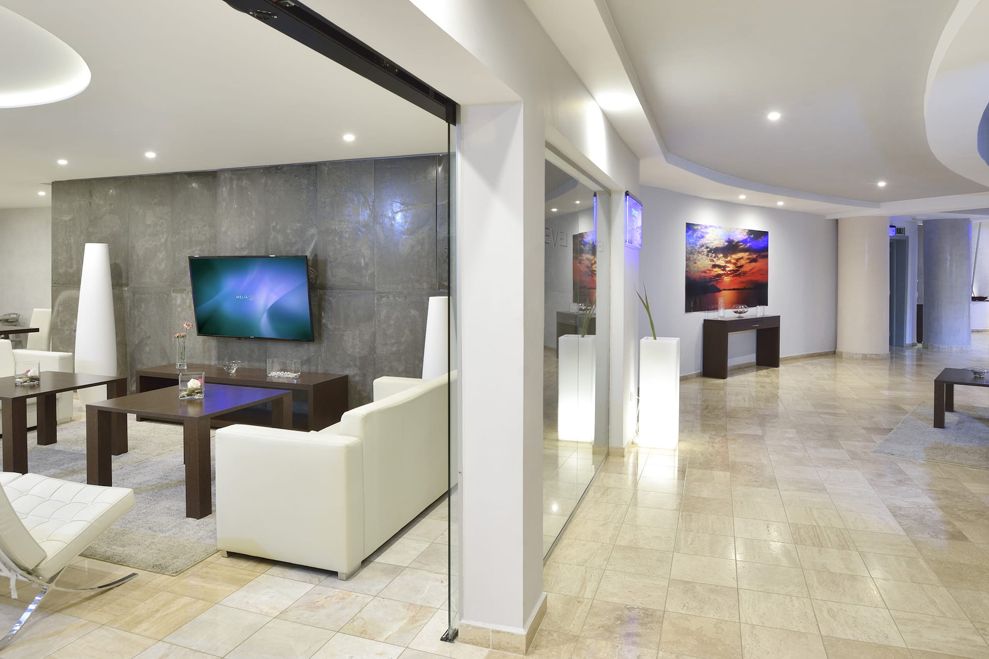 a room with a tv and a wall