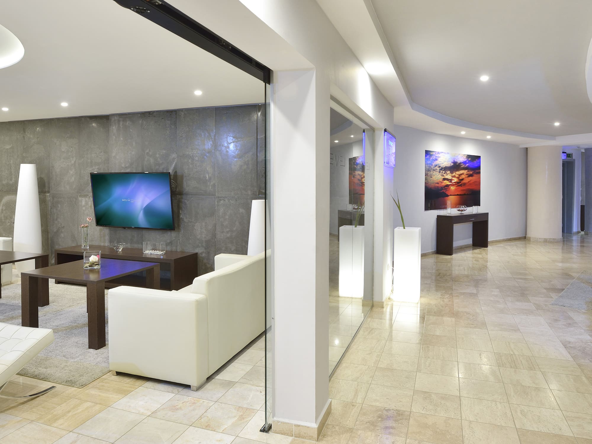 a room with a tv and a wall