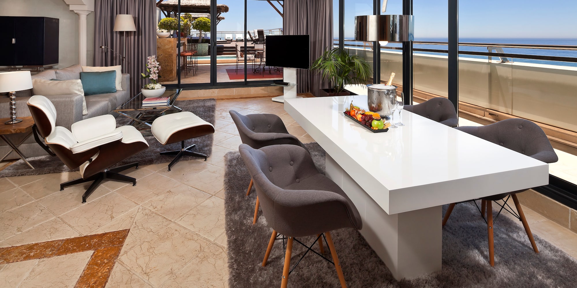 a room with a large table and chairs