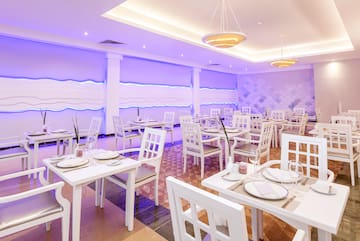 a room with tables and chairs