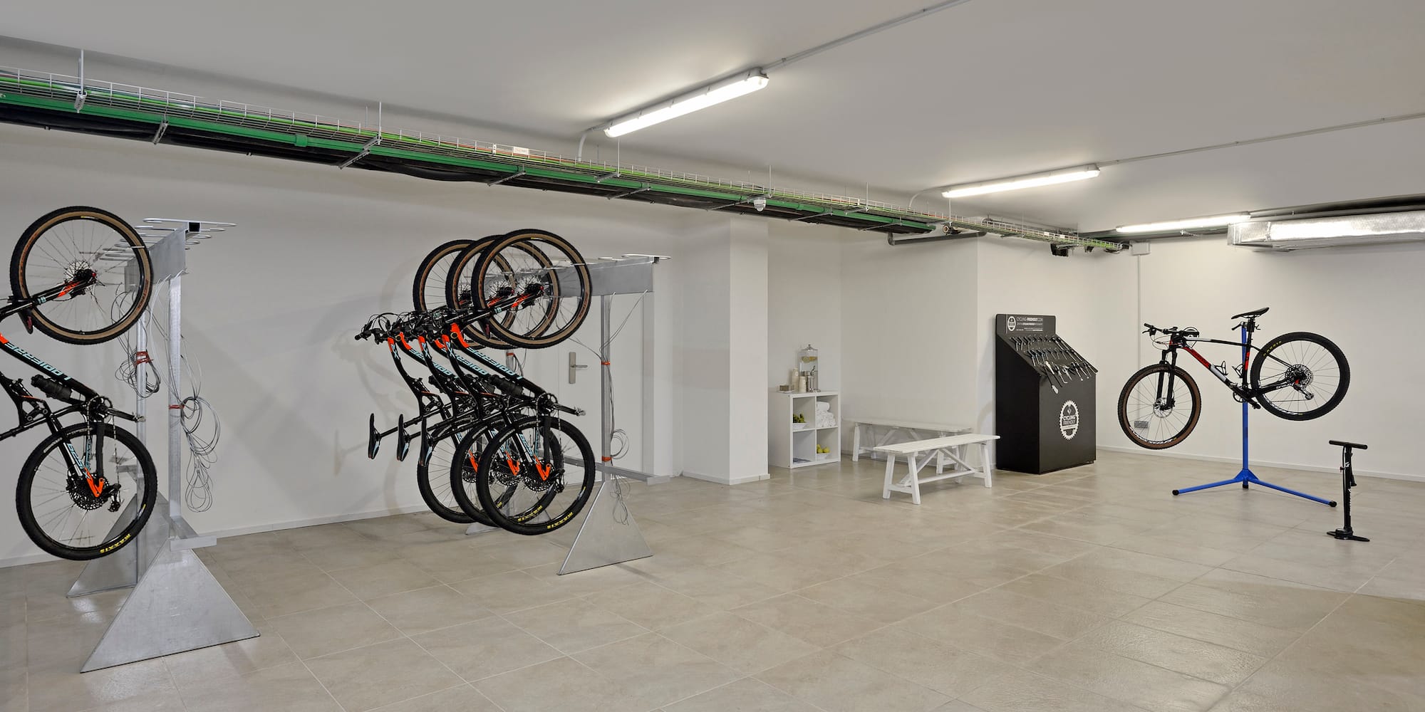 a room with a bike rack and a bench