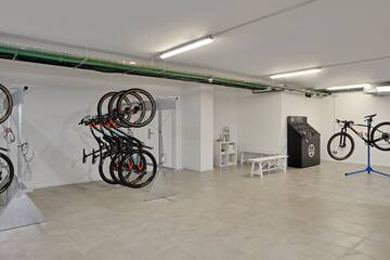 a room with a bike rack and a bench