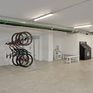 a room with a bike rack and a bench