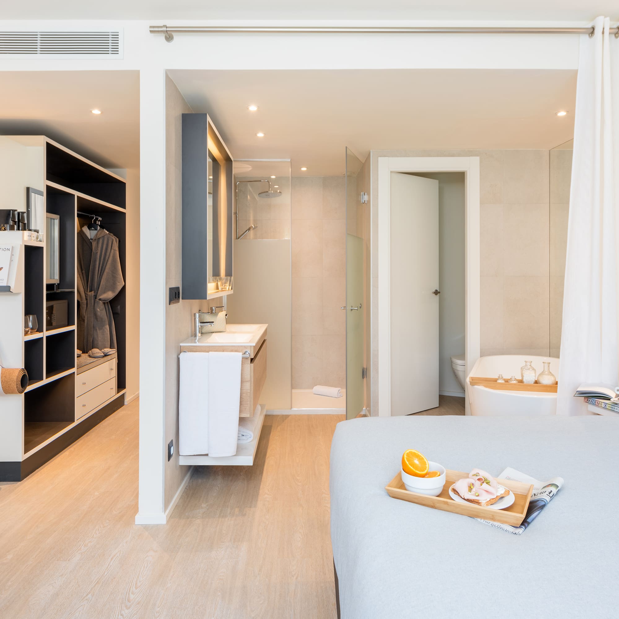 a bedroom with a bed and a bathtub