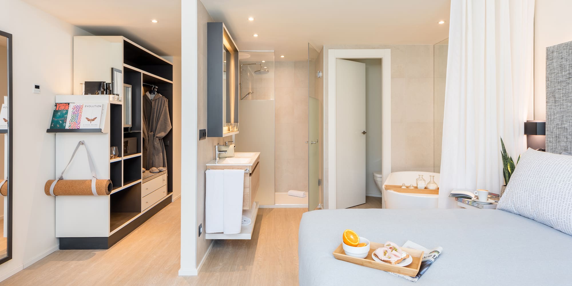 a bedroom with a bed and a bathtub