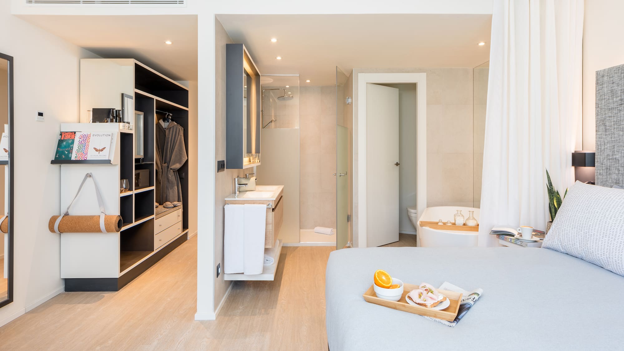 a bedroom with a bed and a bathtub