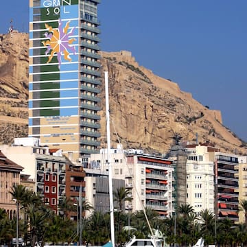 a tall building with a large mural on the side of it