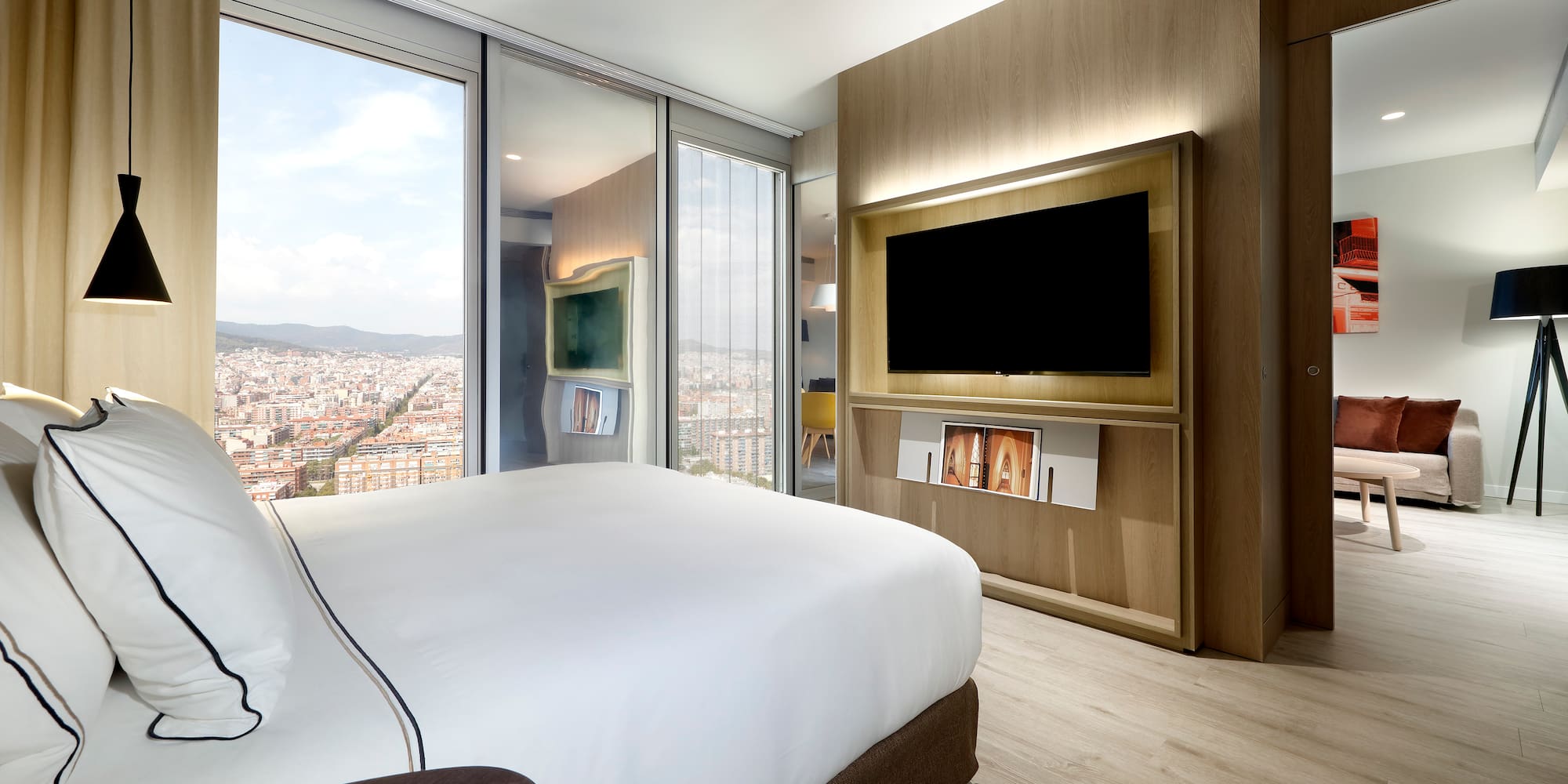 a room with a large television and a large city