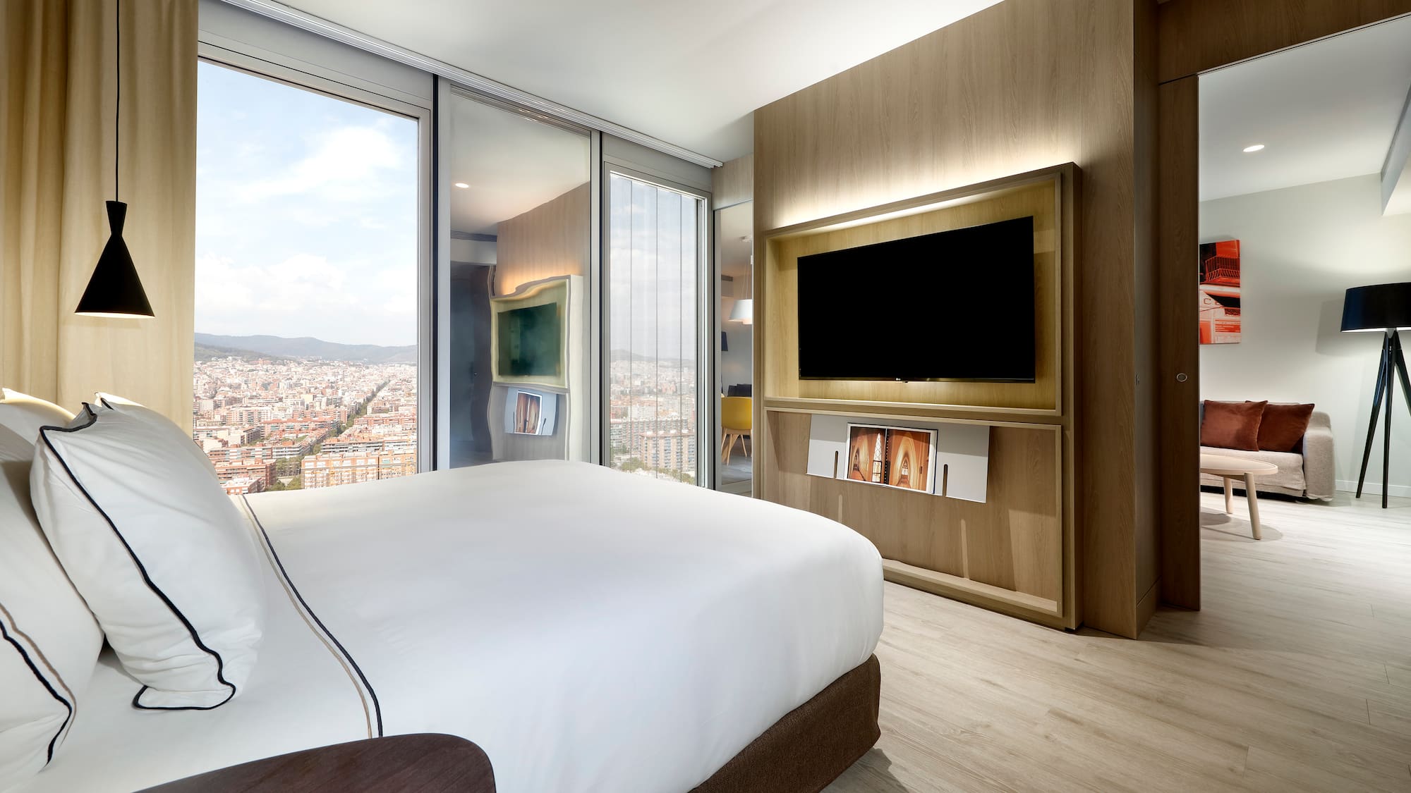 a room with a large television and a large city