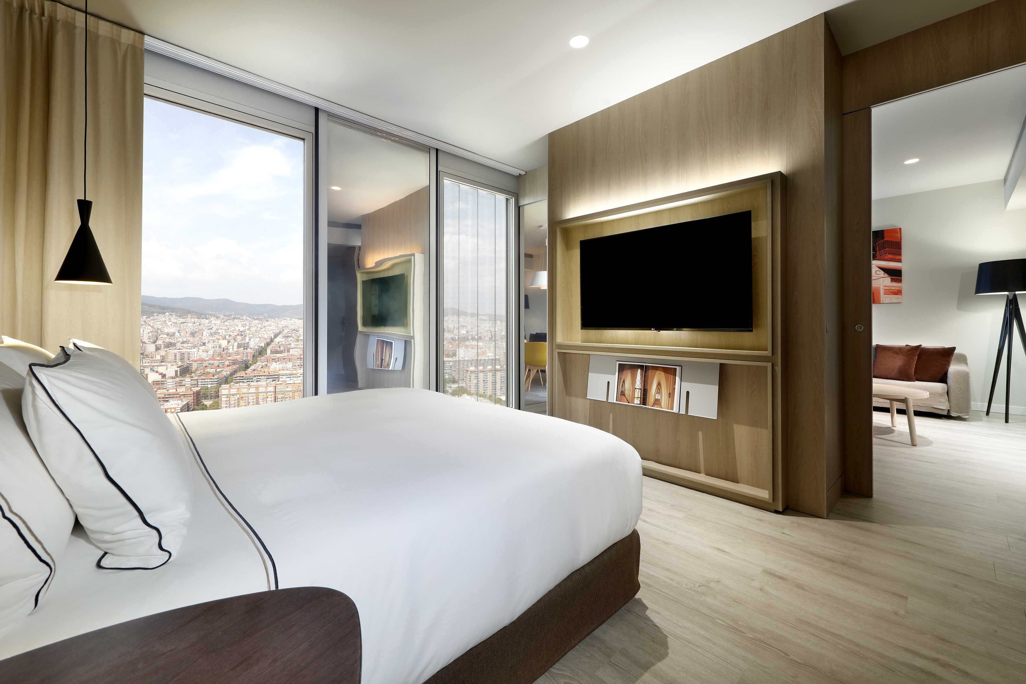 a room with a large television and a large city
