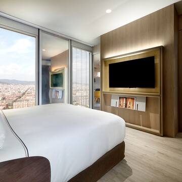 a room with a large television and a large city