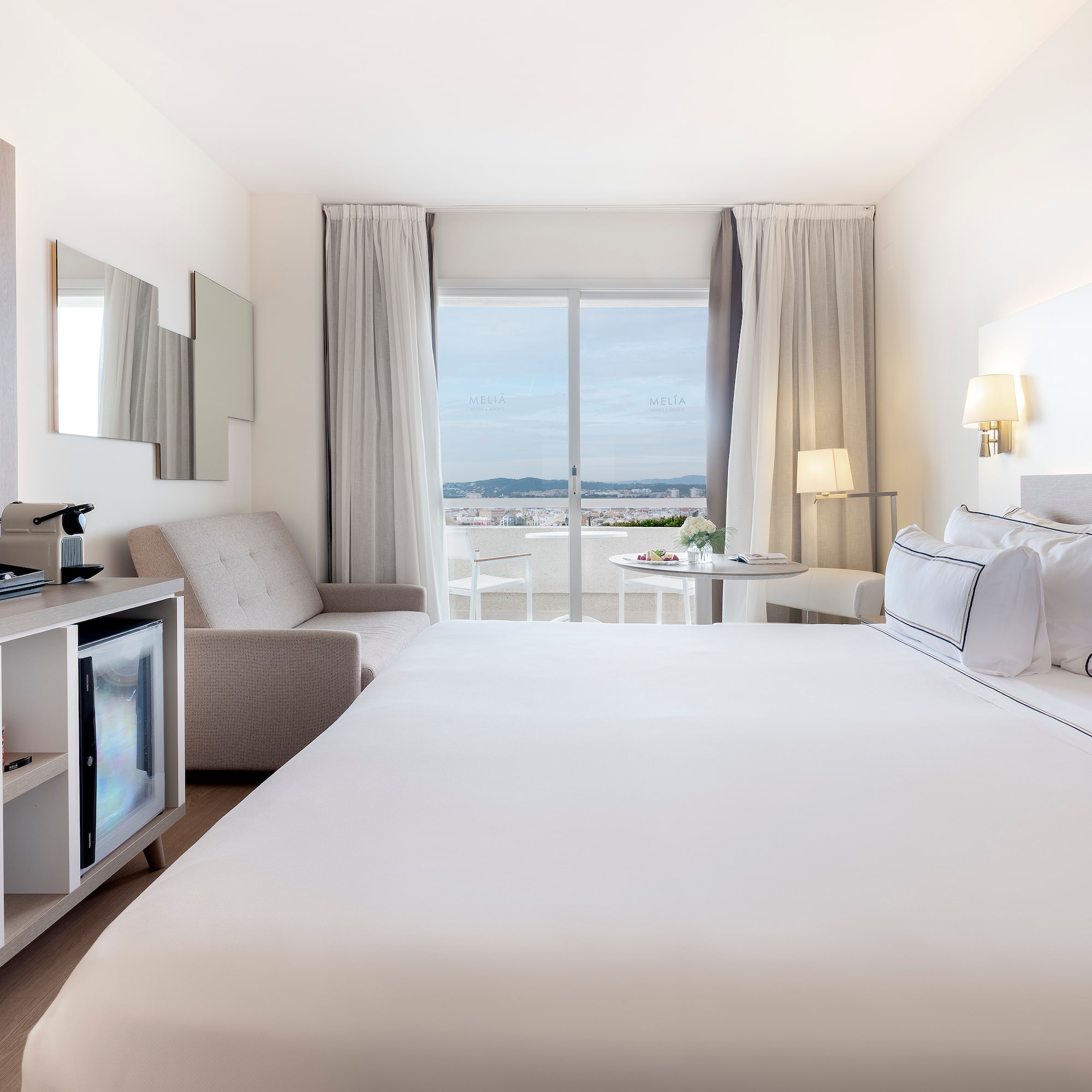 a room with a bed and a television