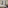 Luxury hotel room with comfortable bed, classic desk, and private balcony.