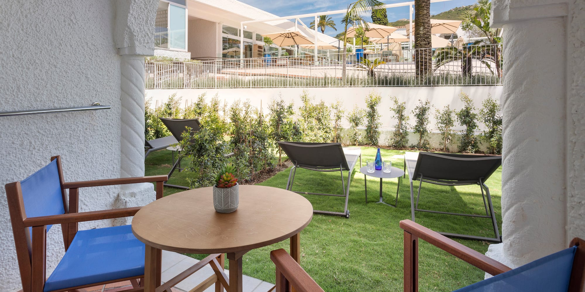 a patio area with chairs and tables