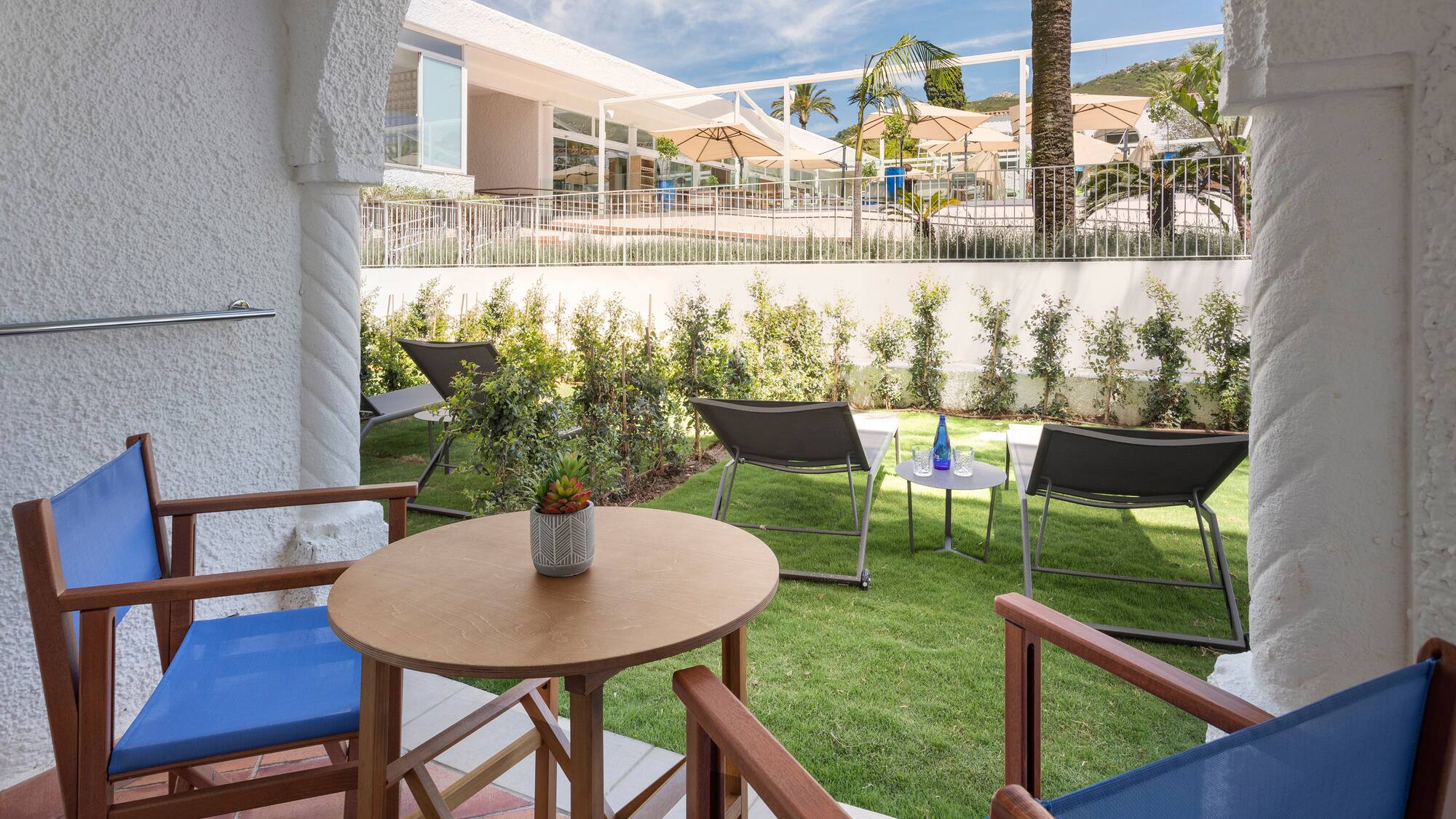 a patio area with chairs and tables