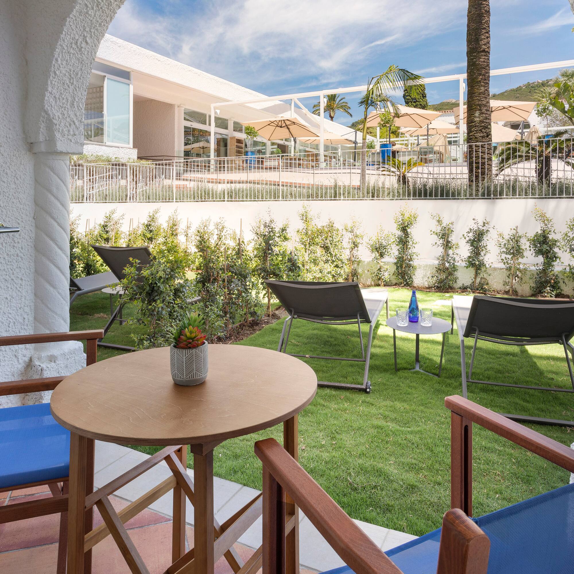 a patio area with chairs and tables