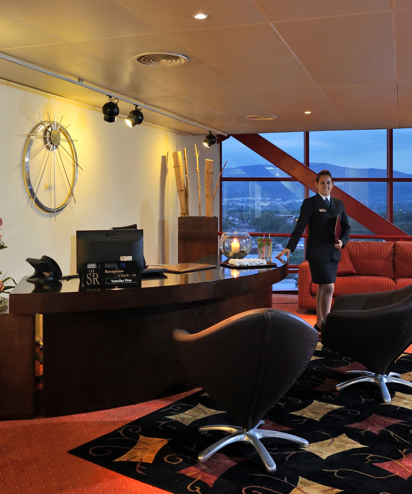 a woman standing in a hotel lobby