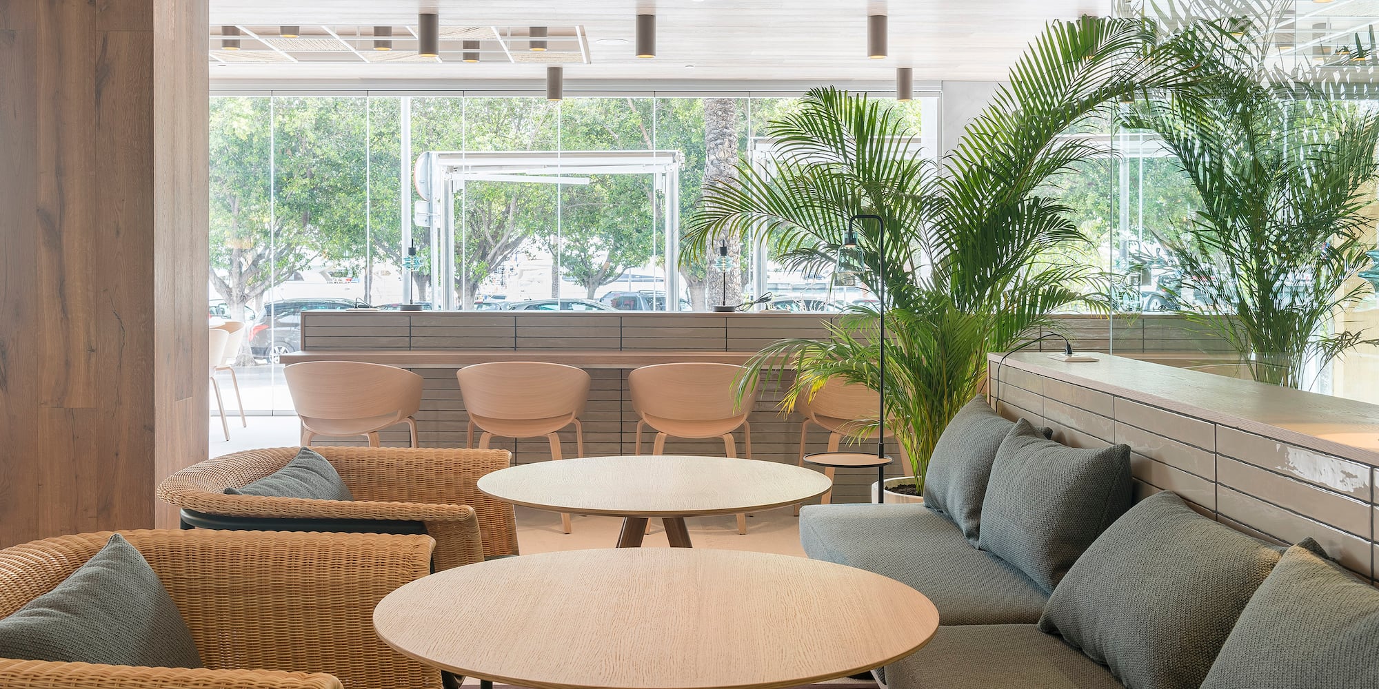 a room with a couch and chairs