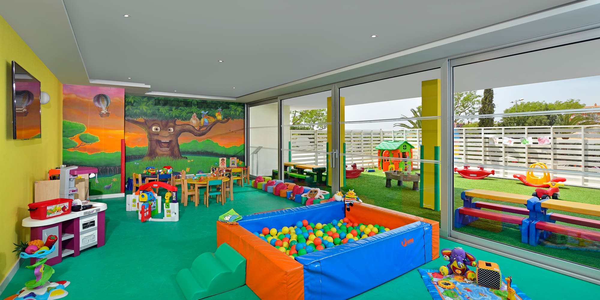 a room with a pool and toys