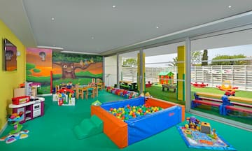 a room with a pool and toys