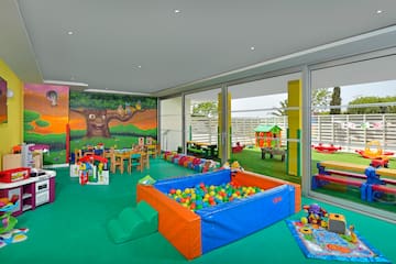 a room with a pool and toys