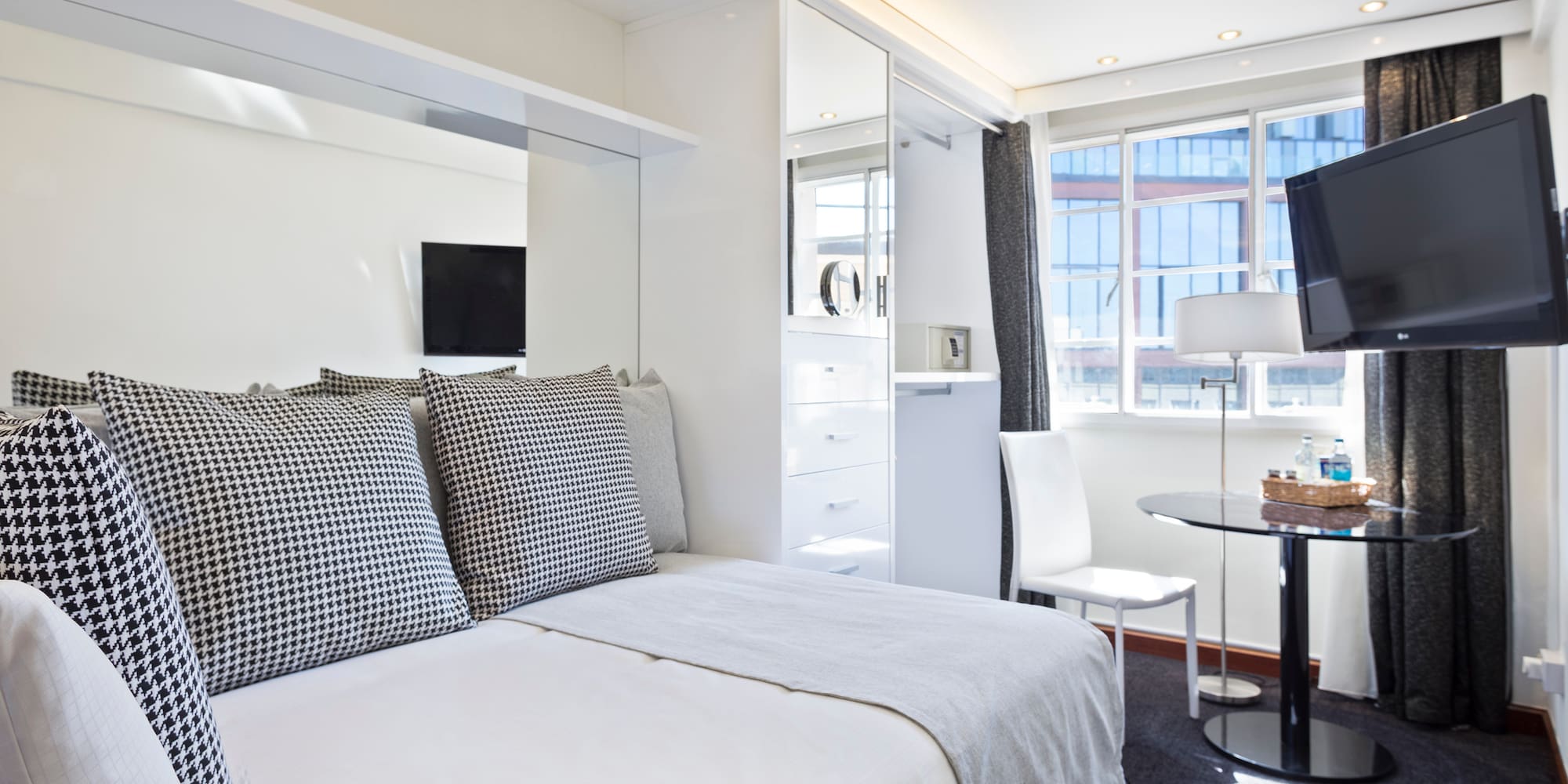 a bedroom with a bed and a desk