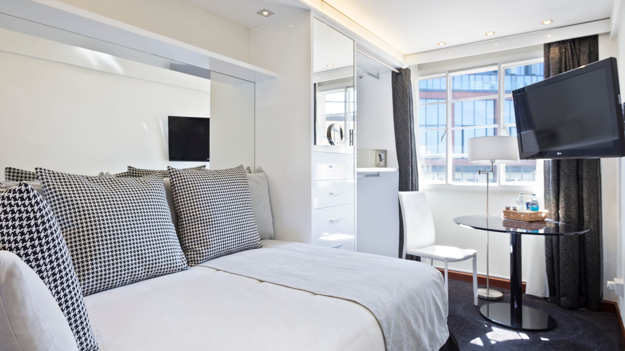 a bedroom with a bed and a desk