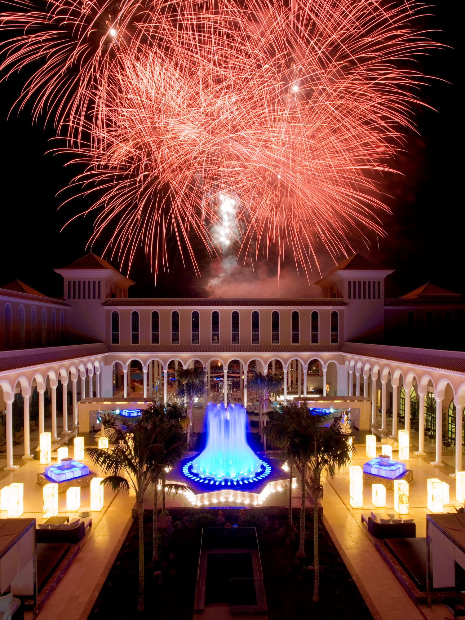fireworks in the sky above a building