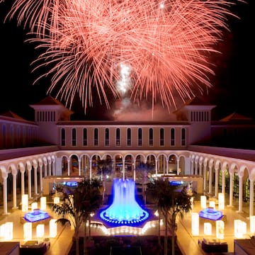 fireworks in the sky above a building