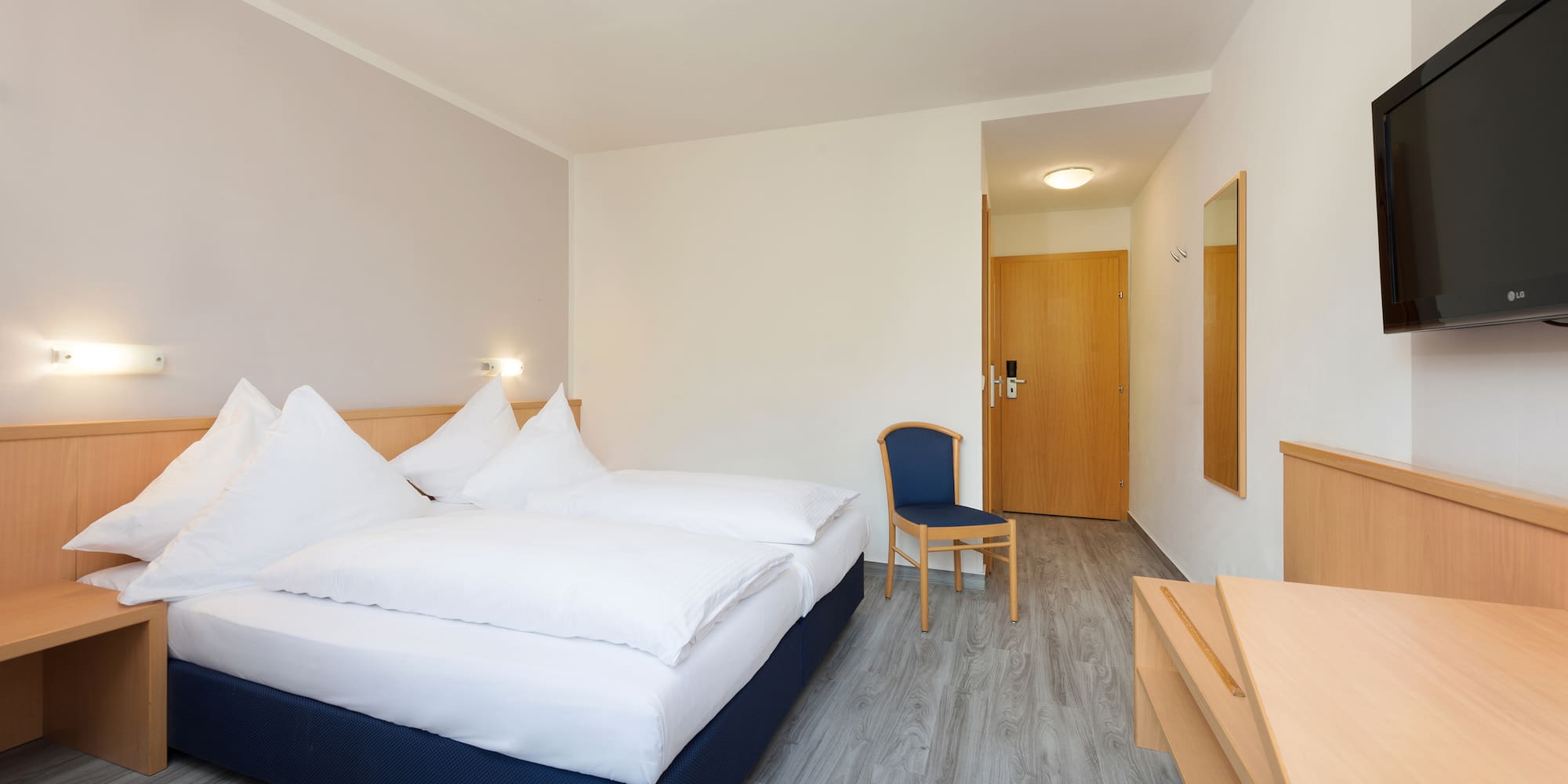 a room with a bed and a chair