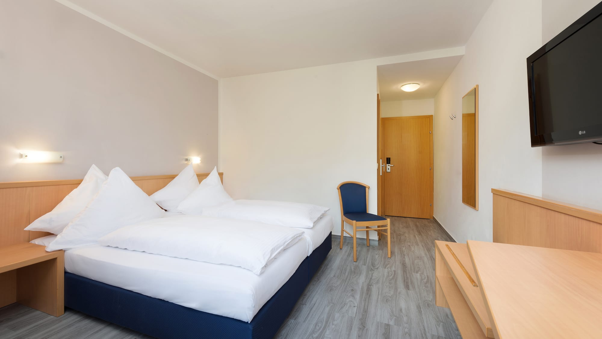 a room with a bed and a chair