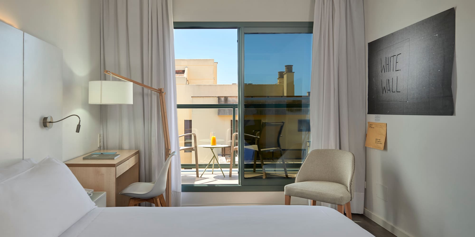 a bedroom with a bed and a chair