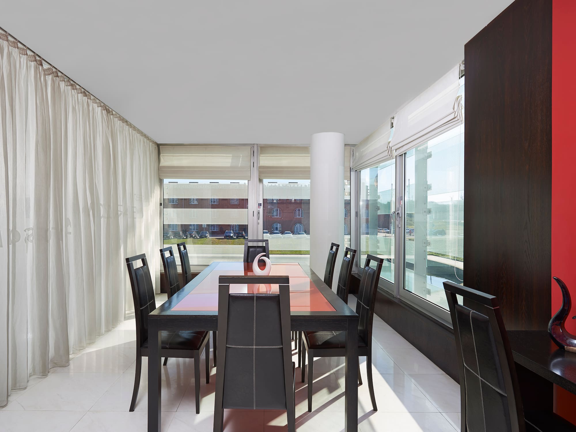 a dining room with a table and chairs