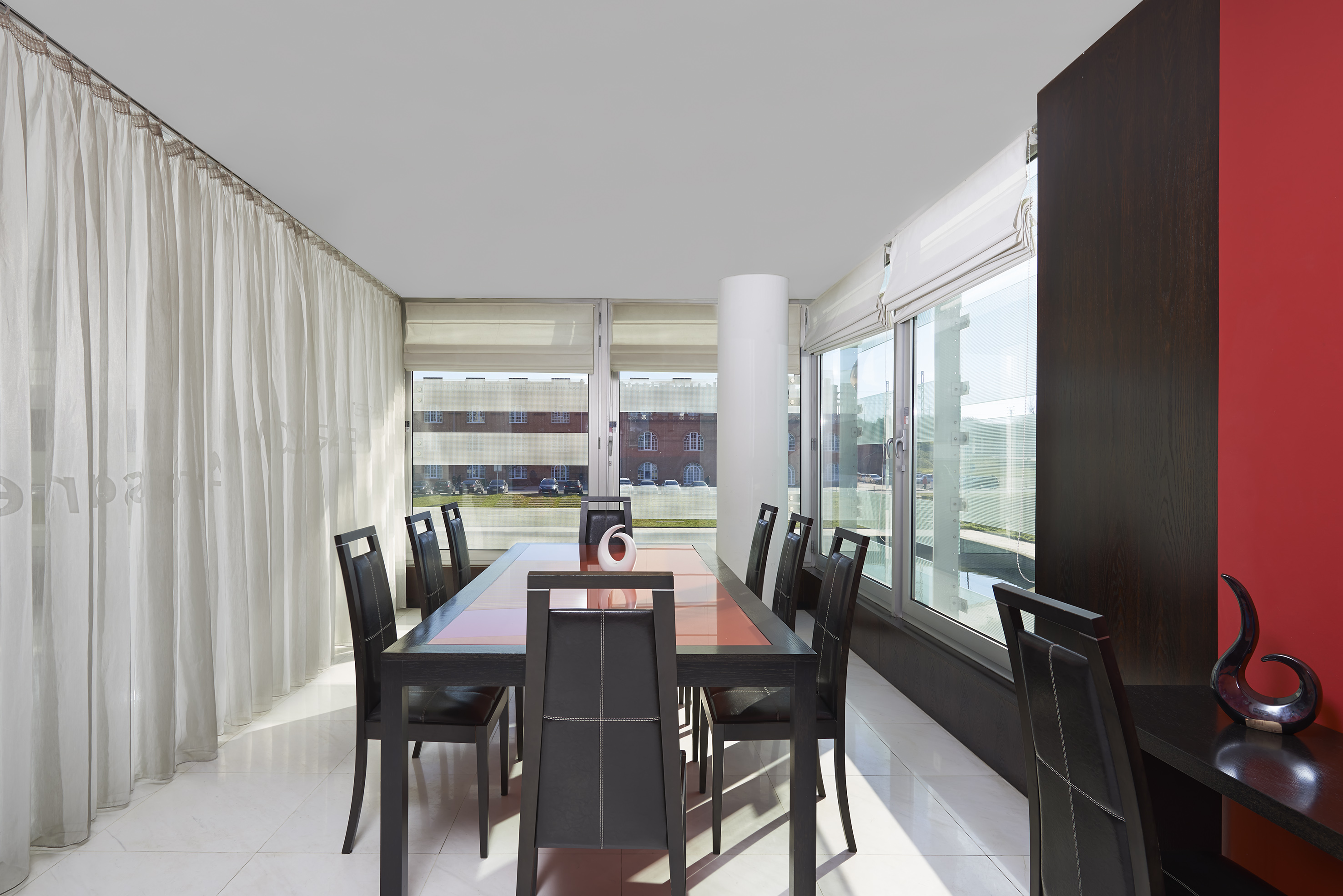 a dining room with a table and chairs