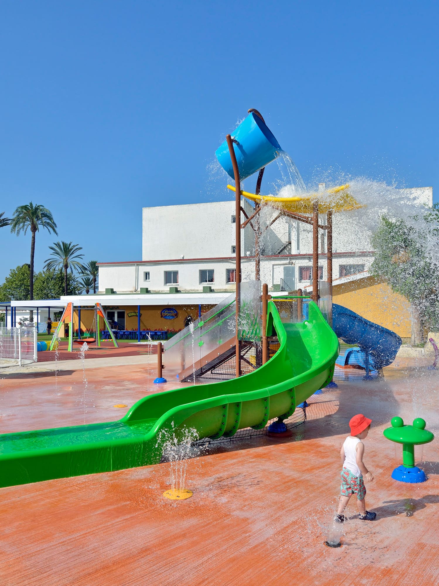 a child playing in a water park