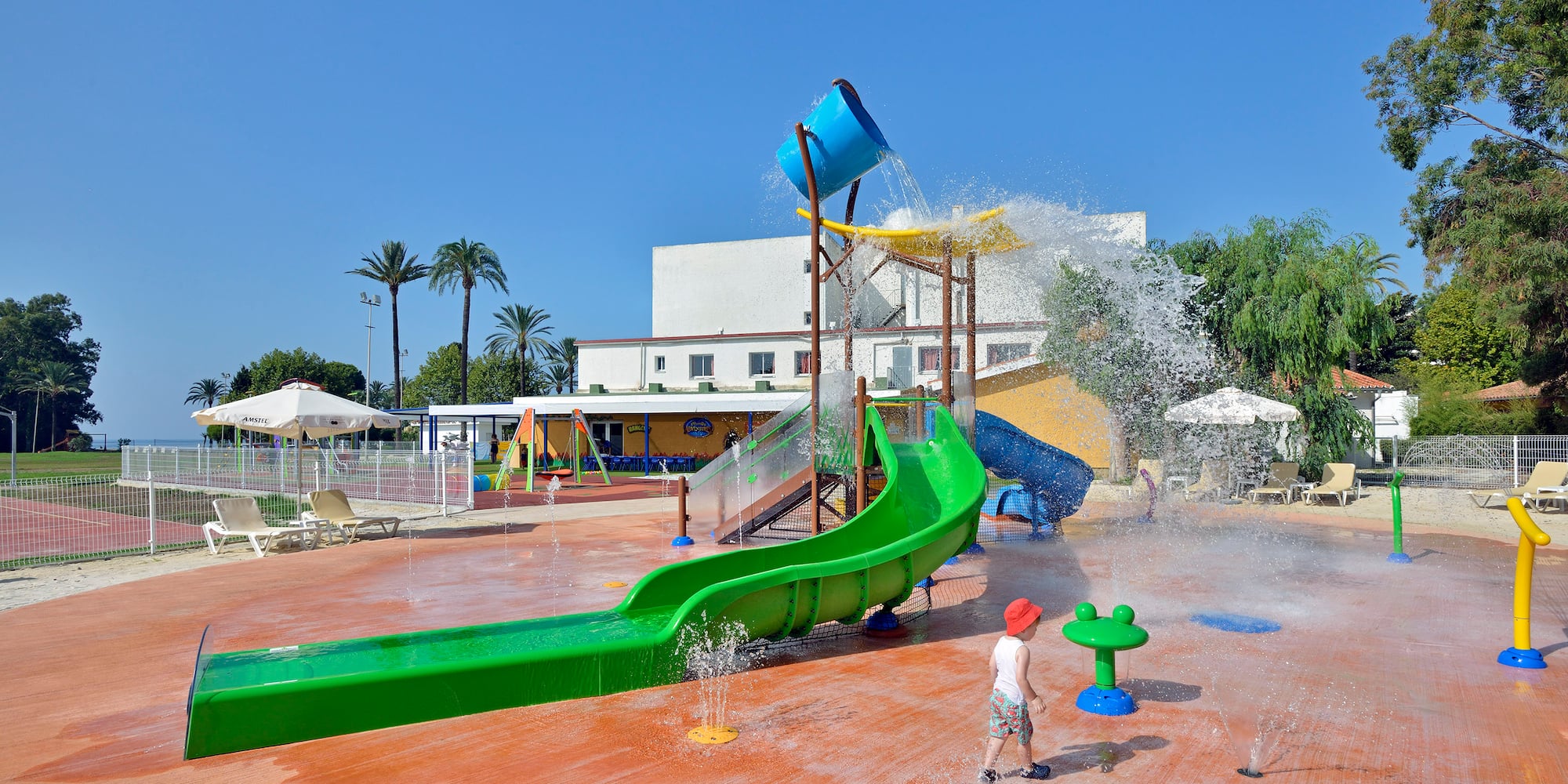 a child playing in a water park